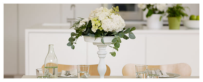 DIY centrepiece from candlesticks and cake tins